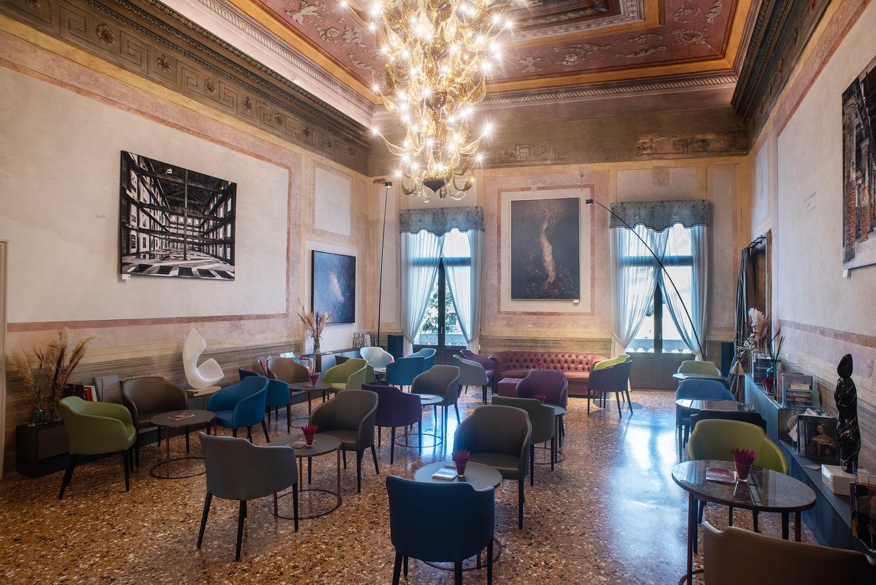 The lounge with Murano glass chandelier at Hotel Aquarius Venice